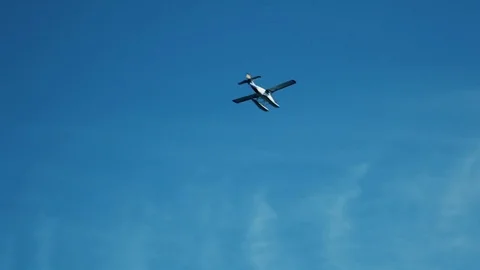 Seaplane flying to the clouds Stock Footage 74464471