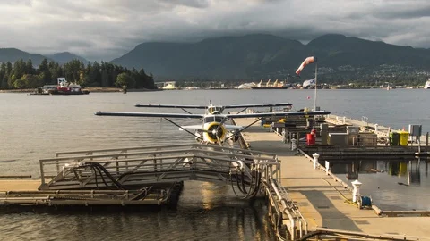 Seaplane Parked at Dock Time lapse During Sunset Hours in Picturesque Setting Stock Footage 93262185