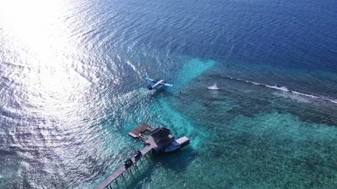 Seaplane on the runway, get ready to take off. Tropical atoll island in Maldives Stock Footage 201063943