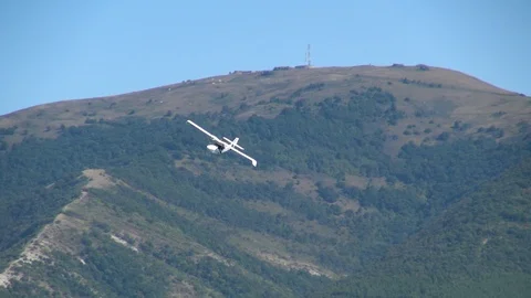 Seaplane SK-12 Orion performs horizontal flight over waters of Gelendzhik Bay. Stock Footage 121888878