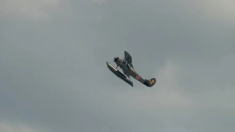 Seaplane U-2 or Po-2 (NATO: "Mule"). Seaplane performs aerobatics over Bay. Stock Footage 131583637