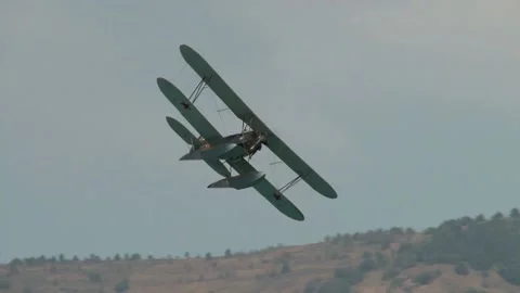 Seaplane U-2 or Po-2 (NATO: "Mule"). Seaplane performs aerobatics over Bay. Stock Footage 131583650