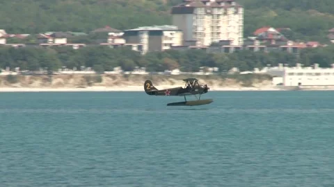 Seaplane U-2 or Po-2 (NATO codification: "Mule"). Seaplane lands on water. Stock Footage 131583695