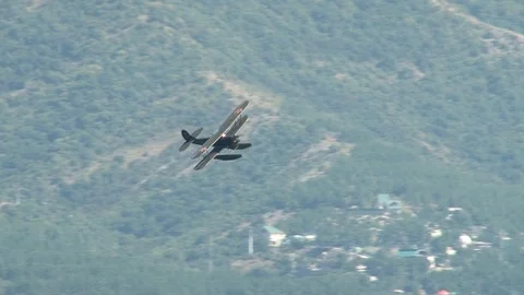 Seaplane U-2 / Po-2 (NATO: "Mule") performs aerobatics over Gelendzhik Bay. Stock Footage 121497432