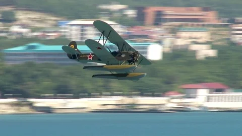 Seaplane U-2 / Po-2 (NATO: "Mule") performs aerobatics over Gelendzhik Bay. Stock Footage 121497478