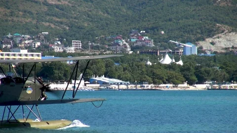 Seaplane U-2 / Po-2 (NATO: “Mule”) floats along Gelendzhik Bay like boat. Stock Footage 121888927