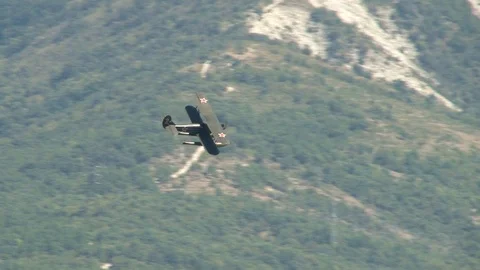 Seaplane U-2 / Po-2 (NATO: "Mule") performs aerobatics over Gelendzhik Bay. Stock Footage 123329220