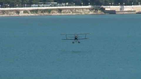 Seaplane U-2 / Po-2 (NATO: “Mule”) lands on water. Stock Footage 123635254