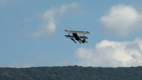 Seaplane U-2 / Po-2 (NATO: "Mule") performs aerobatics over Gelendzhik Bay. Stock Footage 125381878