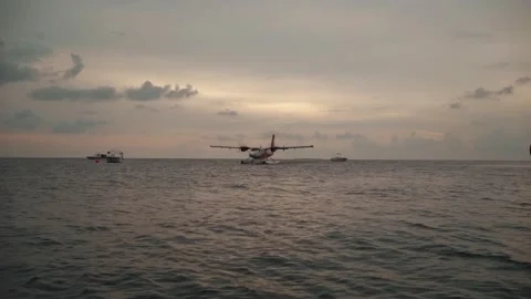 The seaplane on the water at sunset Stock Footage 146887177
