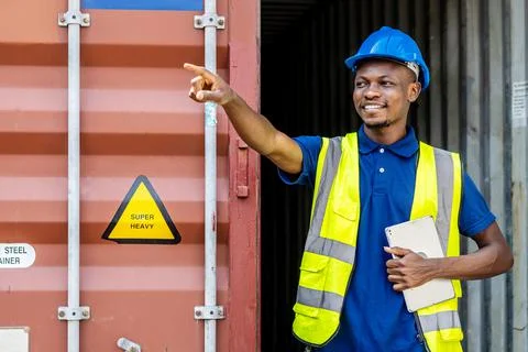 Seaport inspector checking and pointing to position loading Containers box Stock Photos