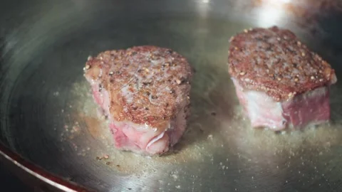 Sear steaks in pan Stock Footage 297718741