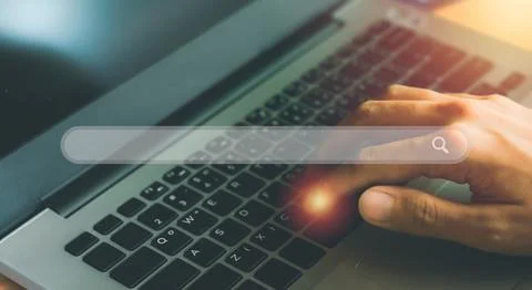 Search engine browser concept. Hand typing on laptop or computer searching .. Stock Photos