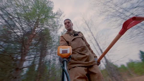 A search engine with a metal detector searches for blood in the ground. Stock Footage 319338941