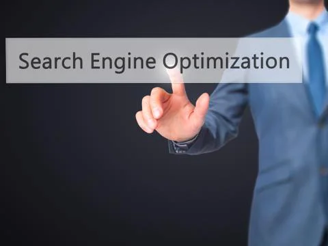 Search Engine Optimization -  Businessman press on digital screen. 스톡 사진