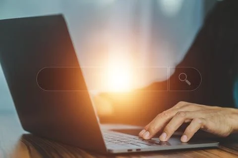 Search engine optimization ,Businesswoman using laptop searching Browsing Int Stock Photos