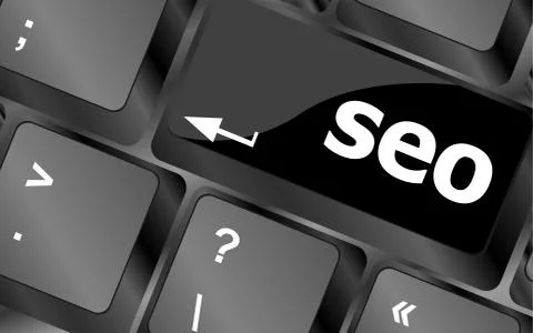 Search engine optimization. SEO button on the keyboard. Business concept Illustrazione stock