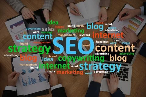 Search engine optimization (SEO). Cloud of words above marketing team devel.. Stock Photos