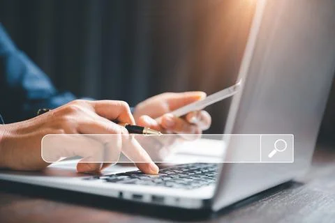 Search Engine Optimization SEO, data searching technology. business hands t.. Stock Photos