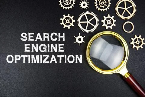 Search Engine Optimization text message with magnifying glass on black back.. Stock Photos