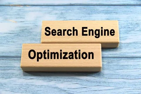 Search engine optimization wording  or text on wood block with blue backgro.. Stock Photos