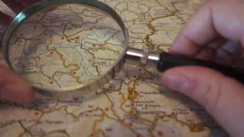 Search on map with magnifying glass Stock Footage 77616418