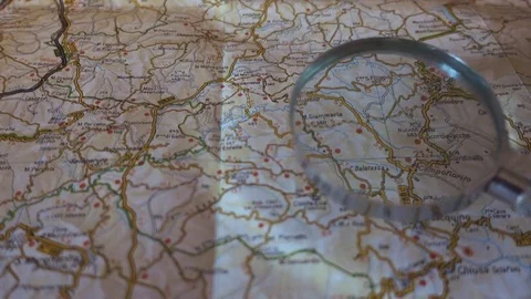 Search on map with magnifying glass Stock Footage 77616728