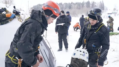 The search party assembles a tent in winter. Stock Footage 258966458