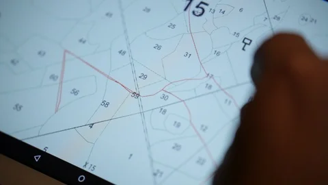 The search team is looking at the map Stock Footage 92695259