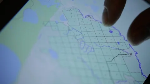 The search team is looking at the map Stock Footage 92695384