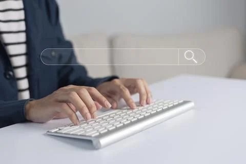 Search technology, search engine optimization, man's hand using computer keyb Stock Photos