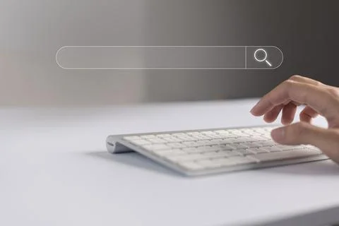 Search technology, search engine optimization, man's hand using computer keyb Stock Photos