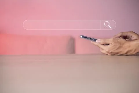 Search technology, search engine optimization, man's hand using smartphone to Stock Photos