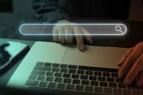 Search technology, search engine optimization, man's hand using laptop to sea Stock Photos