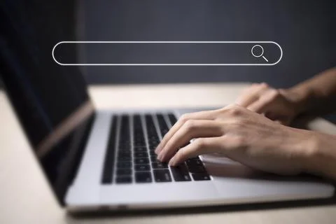 Search technology, search engine optimization, man's hand using laptop to sea Stock Photos