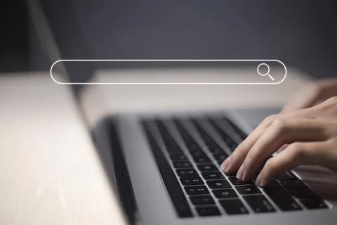 Search technology, search engine optimization, man's hand using laptop to sea Stock Photos