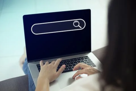 Search technology, search engine optimization,person using laptop to search i Stock Photos