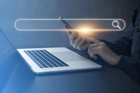 Search technology, search engine optimization,person using laptop to search i Stock Photos