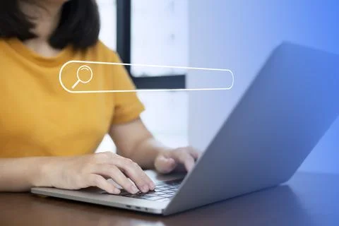 Search technology, search engine optimization,person using laptop to search i Stock Photos