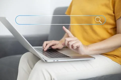 Search technology, search engine optimization,person using laptop to search i Stock Photos