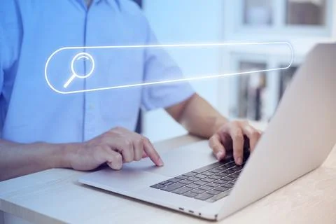 Search technology, search engine optimization,person using laptop to search i Stock Photos