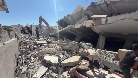 Search underway for missing persons in the collapsed six-story residential build Stock Footage 345669555