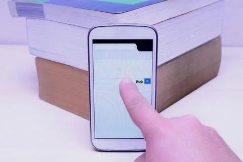 Search on the web with smartphone Stock Photos