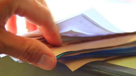 Searching among stack of documents on the table Stock Footage 164537751