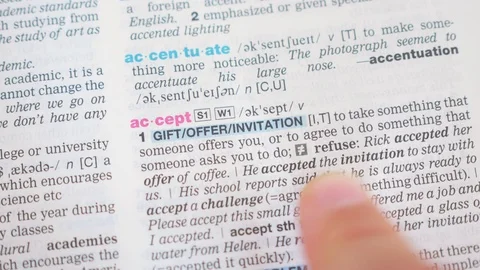 Searching for and finding a word accept definition in a dictionary Stock-Footage 97924914