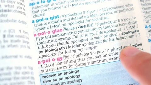 Searching for and finding a word apologize, apology definition in a dictionary Stock Footage 97925268