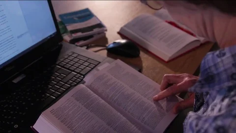 Searching in a book Stock Footage 72510313