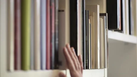 Searching for a book Video stock 146257898