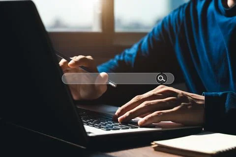 Searching Browsing Internet Data Information with blank search bar.businessma Stock Photos