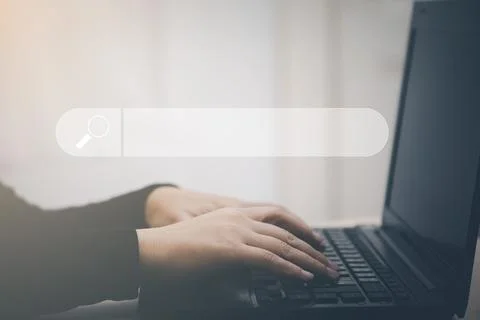 Searching Browsing Internet Data Information with blank search bar. man's han Stock Photos